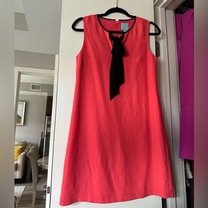 Coral dress with black necktie